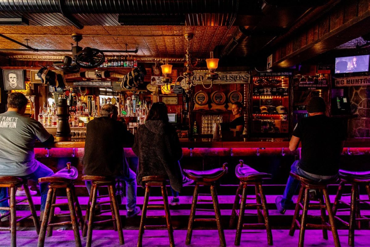 Customers at the bar of The Horse You Came In On Saloon in Baltimore.