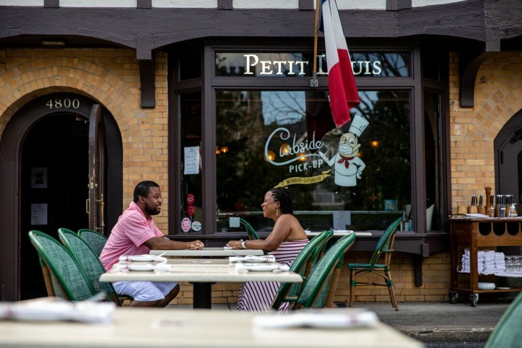 Couple sitting outside restaurant