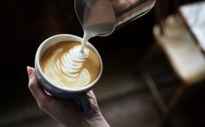 Hands pouring coffee