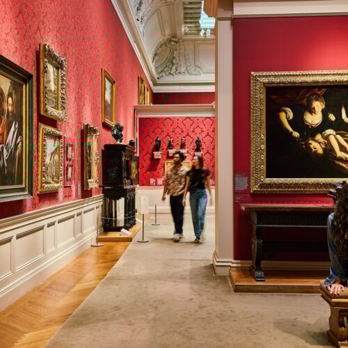 People walking through the gallery at the Walters Art Museum