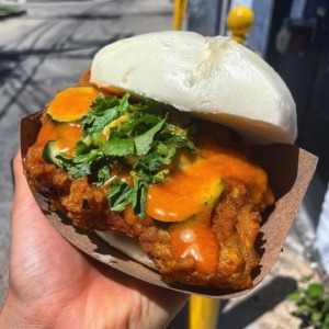 Hand holding sandwich