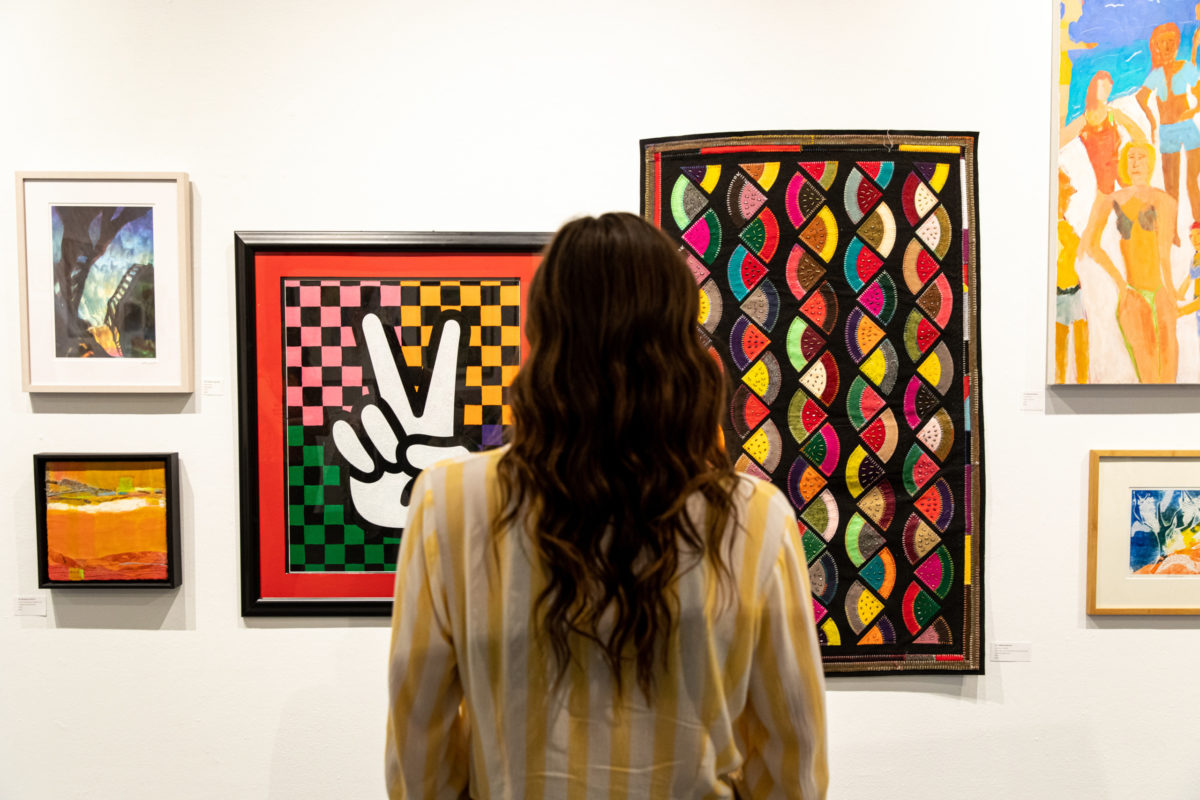 Woman viewing art at Creative Alliance