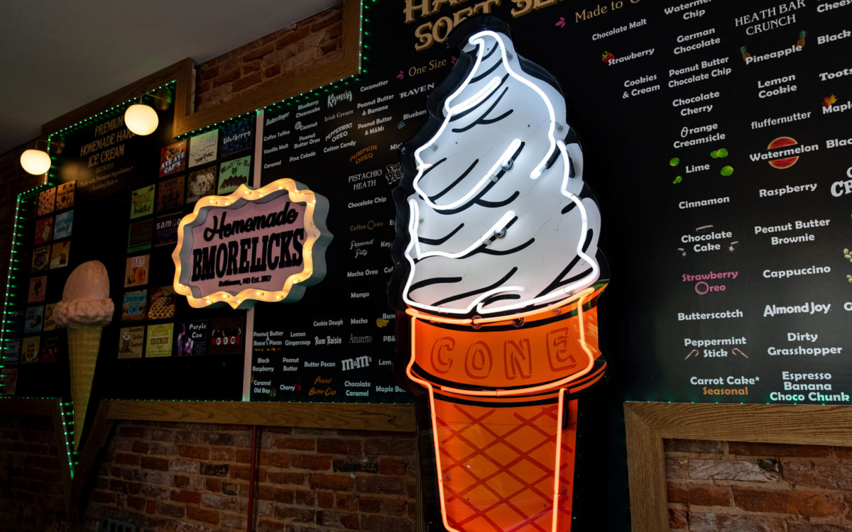 an illuminated ice cream cone sign at Bmore Licks