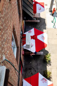 aerial shot of umbrellas over outdoor tables