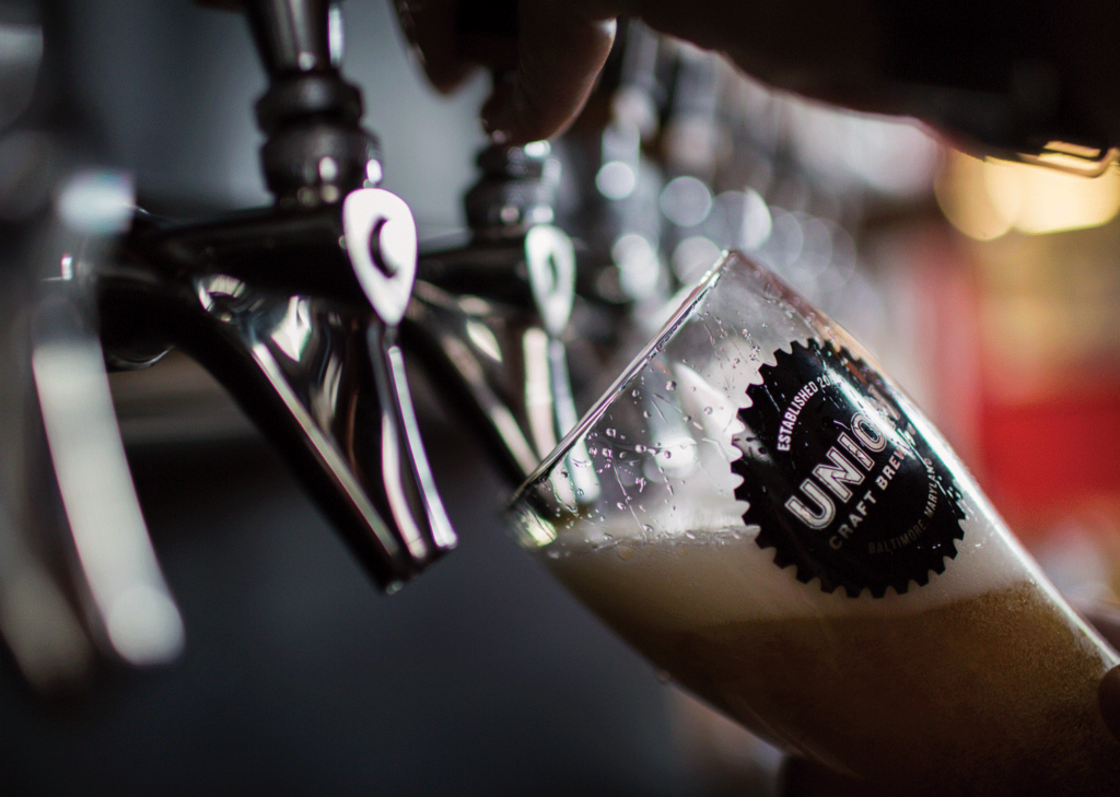 A beer being poured at Union Craft Brewery