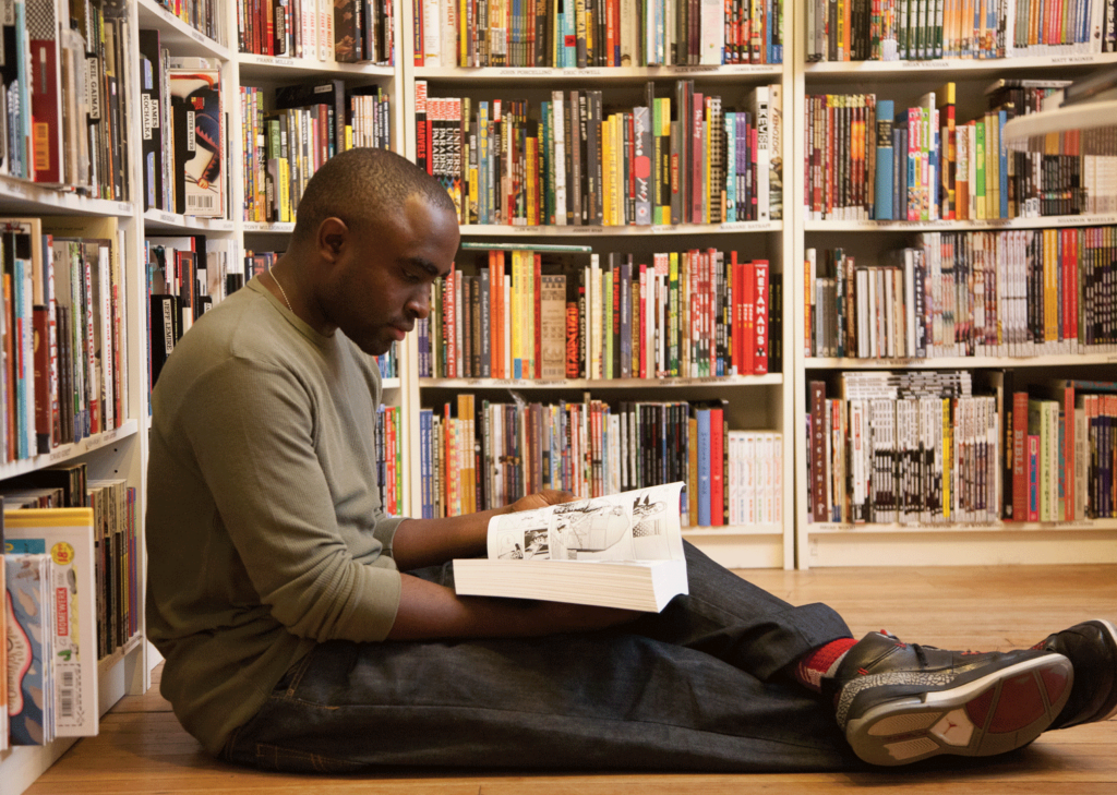 Man reading in Atomic Books Bookstore.